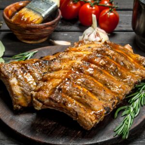 Grilled ribs with sauce, herbs and spices.
